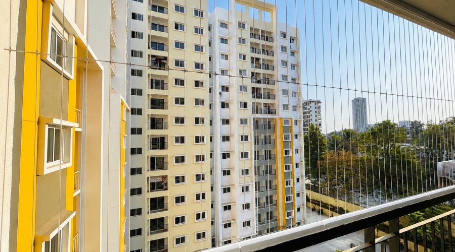Completed invisible grill installation on a high rise apartment window providing clear unobstructed view in Chennai